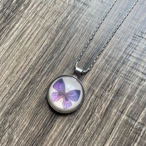 I Pop silver toned necklace with purple butterfly pendant